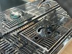 Close-up of a metallic grill with a textured surface