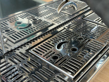 Close-up of a metallic grill with a textured surface